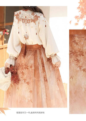 Back view of Maple Leaf Hanfu set showing embroidered cloud shoulder design and pleated skirt with maple leaf print.