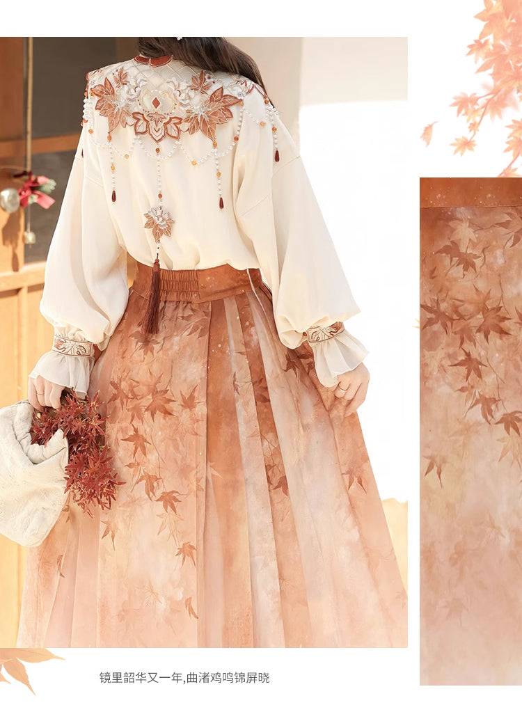 Back view of Maple Leaf Hanfu set showing embroidered cloud shoulder design and pleated skirt with maple leaf print.