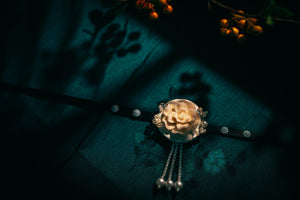 Elegant Korean traditional headgear with cream rose and pearl tassels on black ribbon, ideal for hanbok and formal wear.