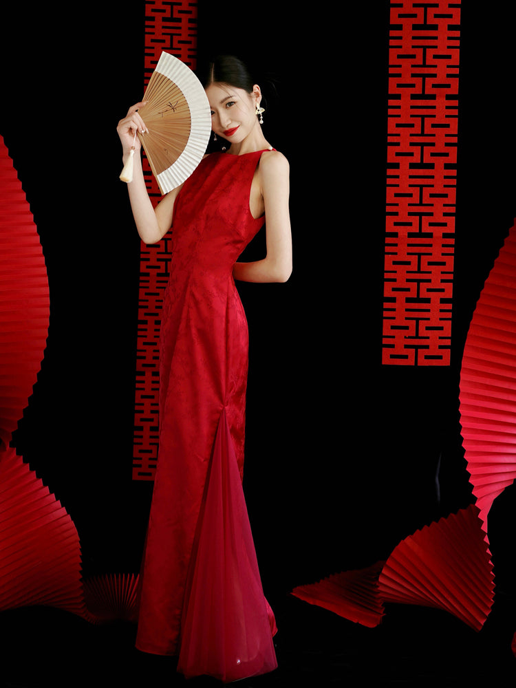 Bride in red cheongsam dress playfully holding fan, ideal for wedding toasting or engagement events.