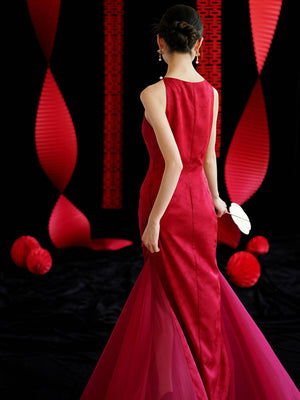 Back view of red cheongsam wedding dress with sheer tulle train, ideal for bridal engagement or toasting.