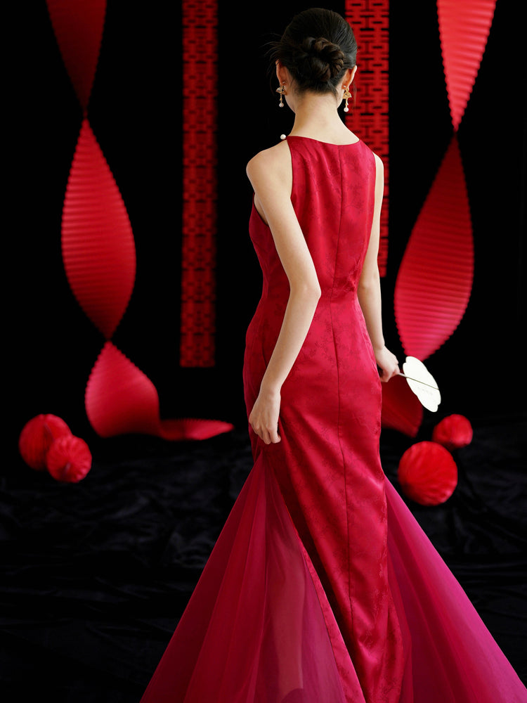 Back view of red cheongsam wedding dress with sheer tulle train, ideal for bridal engagement or toasting.
