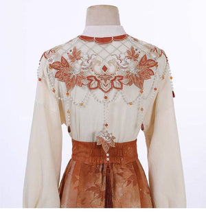 Detailed back embroidery of cloud shoulder top in Maple Leaf Hanfu, showcasing floral and beadwork craftsmanship.