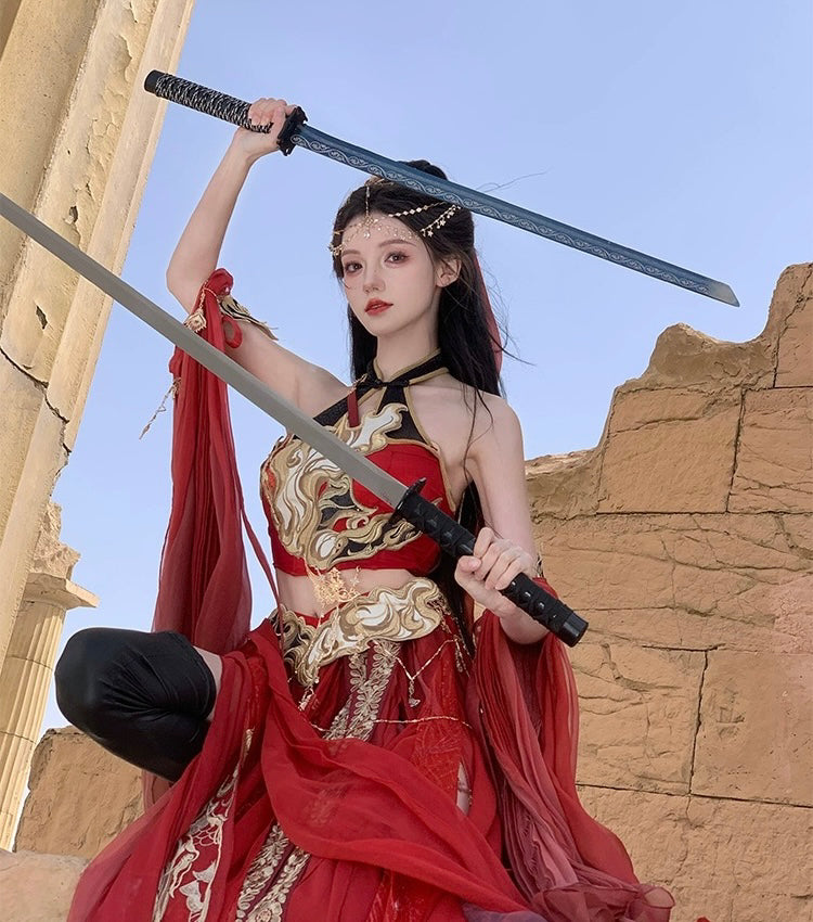 Dual sword pose in red Sacred Flame Western Regions Dancer Hanfu, featuring ornate embroidery and exotic warrior styling.