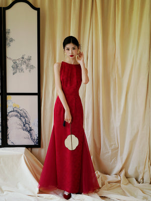 Bride in red cheongsam dress with fan, standing in front of traditional screen, ideal for engagement or wedding.