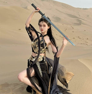 Black Sacred Flame Western Regions Dancer Hanfu Women's Exotic Style with gold trim, posed in desert with sword and dramatic flair.