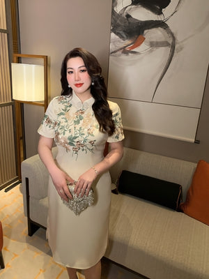 New Chinese style champagne embroidered plus size long cheongsam/qipao with floral detailing, ideal for elegant evening wear.