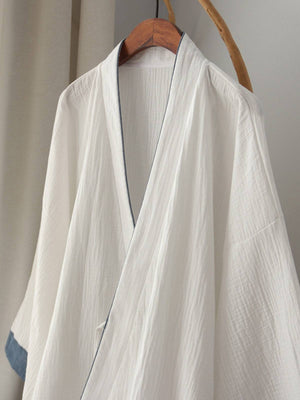 Close-up of Chinese style white Hanfu robe showing soft cotton texture and traditional collar design for premium homewear.