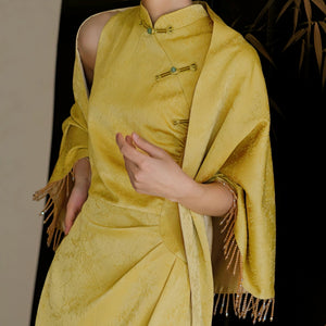 Yellow Cheongsam Wedding Dress styled with white cape and fan, perfect for elegant bridal looks.
