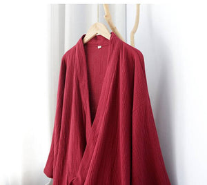 Upper section of the red summer Zen robe on hanger, showing the deep neckline and lightweight cotton fabric ideal for warm nights.