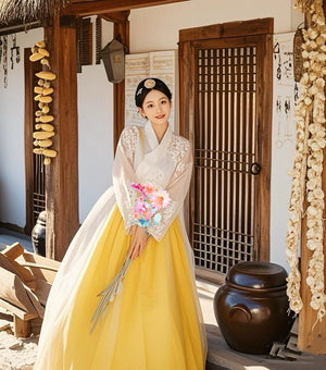 Yellow Korean female high-end genuine Yanji court hanbok with matching petticoat, displayed side-by-side for product comparison.