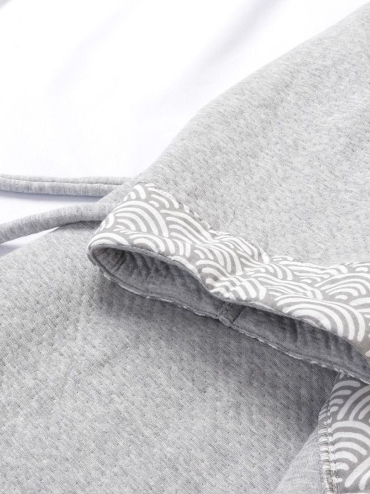 Detailed view of sleeve and waist tie of thickened gray Hanfu pajamas set, highlighting traditional wave-pattern design.