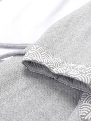 Detailed view of sleeve and waist tie of thickened gray Hanfu pajamas set, highlighting traditional wave-pattern design.