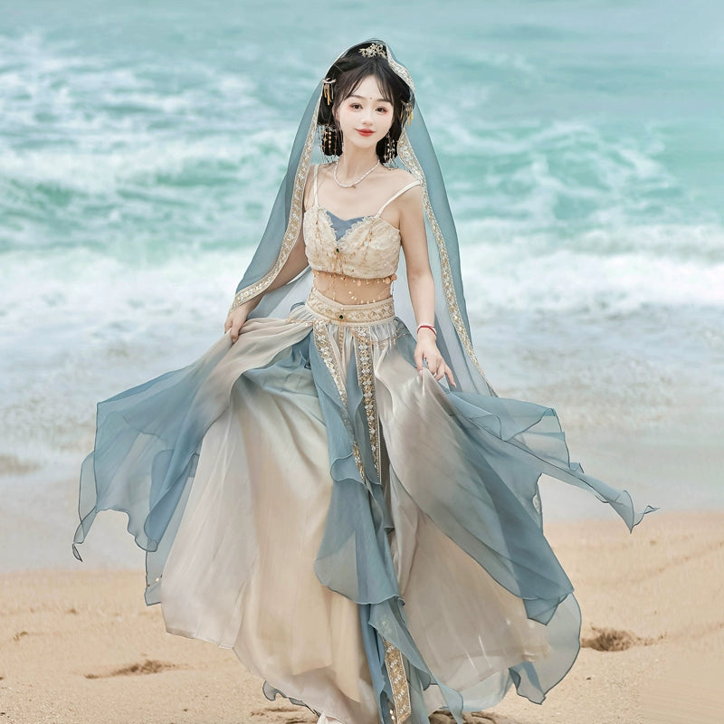 Model in lake blue Dunhuang Goddess Hanfu Dress on the beach, showcasing summer elegance and ancient Chinese style.