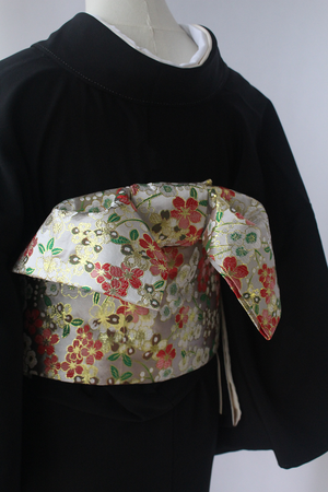 Elegant Brocade Premium Styling Bow Waist Seal tied on black kimono, showcasing detailed floral brocade for traditional Japanese fashion.