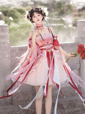 Model holding roses in Red Hanfu Dress New Chinese Feather Rust Waist Seal Suspender Skirt with cascading ribbons and lace trim.