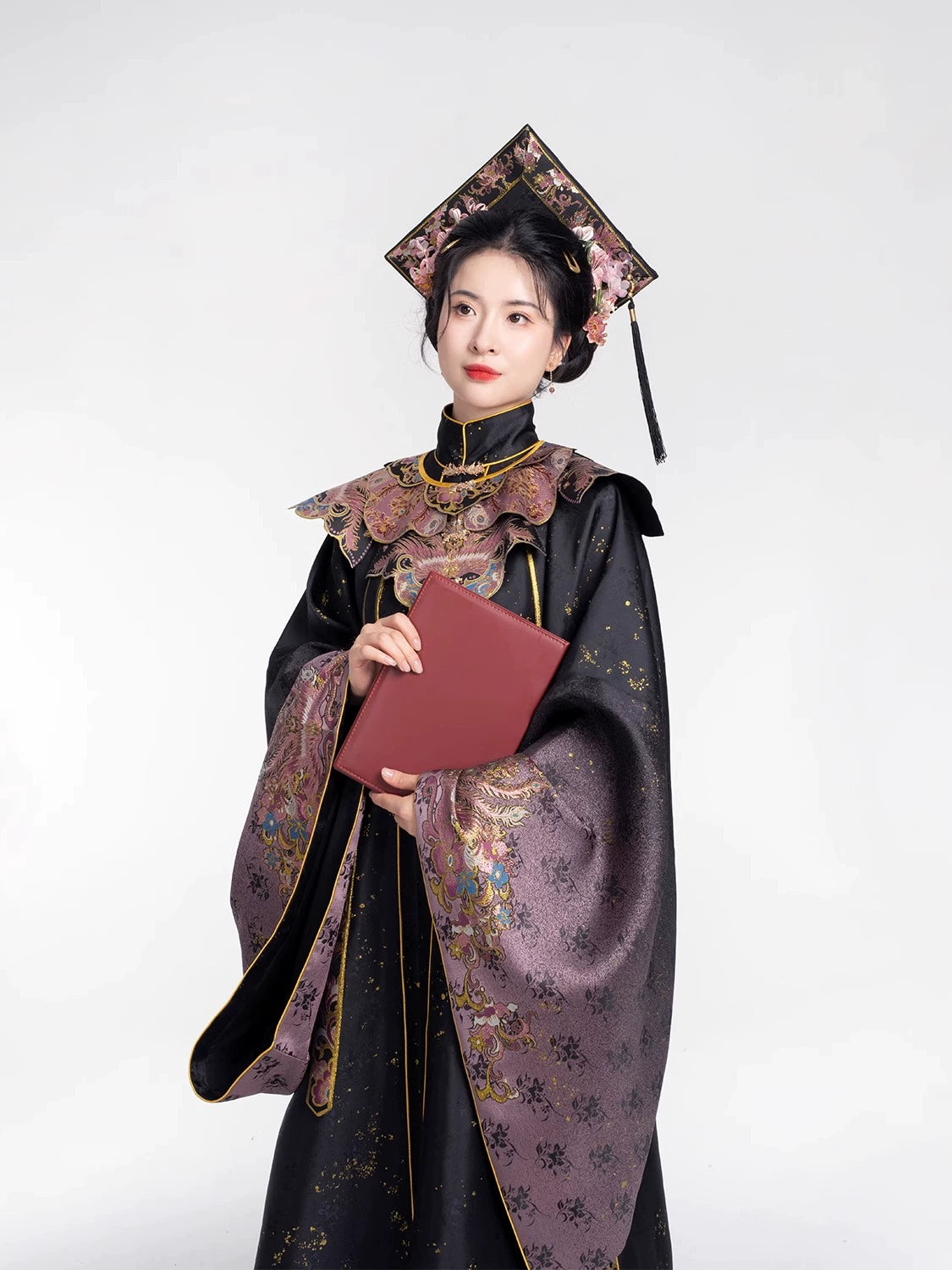 Elegant 2025 Chinese style graduation Hanfu set in black and rose gold with matching top hat, showcasing intricate floral embroidery.