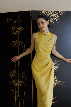 Fitted Yellow Cheongsam Wedding Dress with dark floral texture, ideal for elegant bridal celebrations.