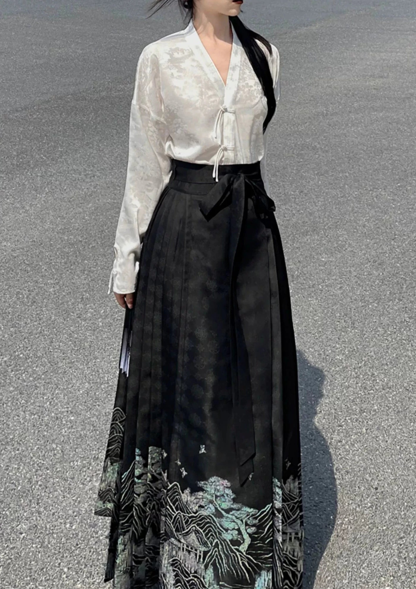 Explore modern elegance with our Black & White Shirt Women's Horse Face Skirt Suit. This ensemble blends traditional Hanfu design with contemporary flair, featuring intricate embroidery and authentic details. Embrace the timeless beauty of Hanfu fashion and make a statement with your unique style.