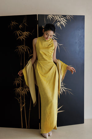 Graceful Yellow Cheongsam Wedding Dress with shawl, featuring a dark jacquard pattern and flattering silhouette.