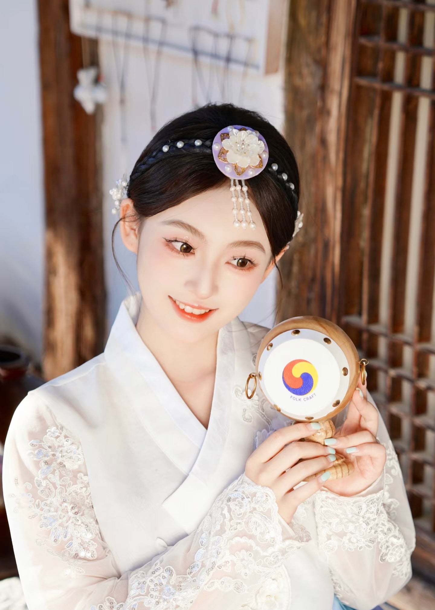 White purple Korean female high-end genuine Yanji court hanbok with embroidered lace top, holding traditional Korean drum.