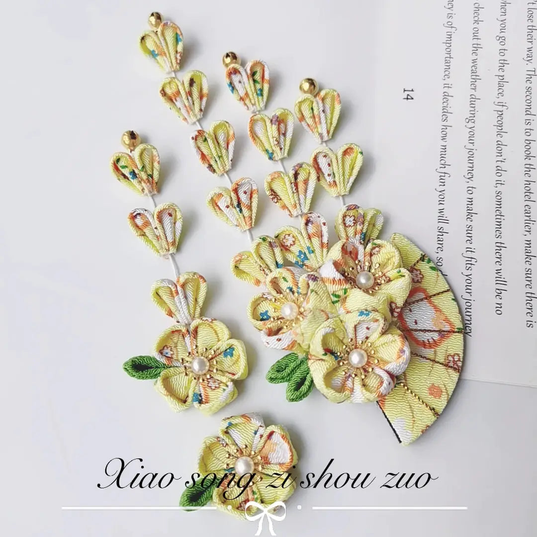 Yellow floral kimono hair accessory set with fan and tassel design, featuring pearl centers and gold bell accents.