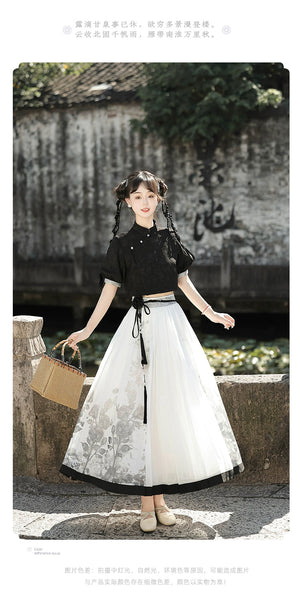 Modern Hanfu black top and floral skirt set styled with a wicker bag, ideal for spring and summer traditional fashion.