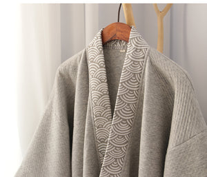 Close-up of collar on gray Hanfu pajamas set, showing intricate wave-pattern trim and soft quilted fabric.