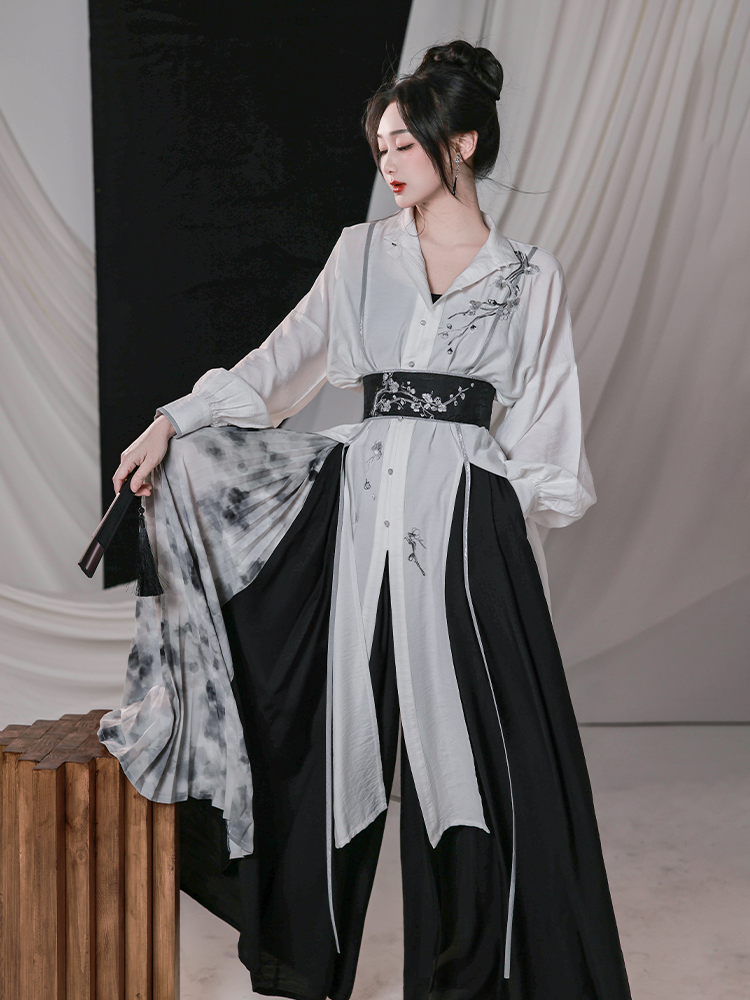 Women's modern Hanfu outfit with plum blossom embroidery, featuring a black and white stand-up collar shirt and wide-leg Song pants for spring and summer.