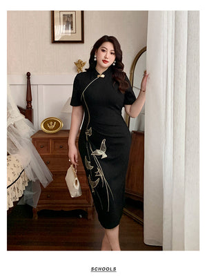 New Chinese style black plus size qipao dress with intricate embroidery, modeled beside a curtain in a classic bedroom.