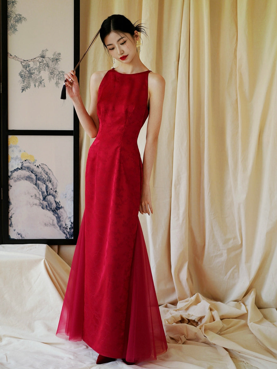 Red cheongsam wedding dress with sheer tulle panels, designed for bridal engagement or toasting occasions.