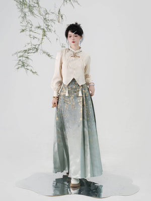 Elegant imitation Ming-dynasty Hanfu skirt for women, adorned with jasmine flower patterns and shimmering gold thread on soft green fabric.