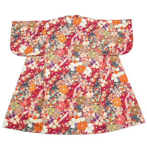 Back view of a dark red Japanese yukata with a beautifully tied obi. A refined choice for festivals and traditional gatherings.