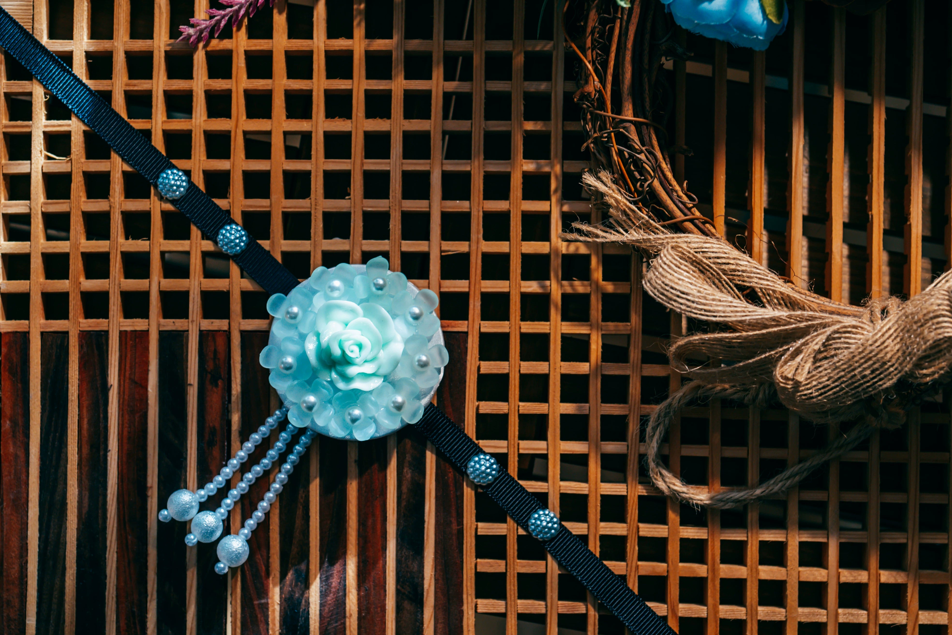 Close-up of B-style Korean traditional headgear with blue rose and pearl tassels, perfect for traditional Korean outfits.