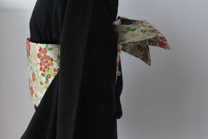 Side profile of Brocade Premium Styling Bow Waist Seal on black kimono, displaying structured bow and floral brocade texture.
