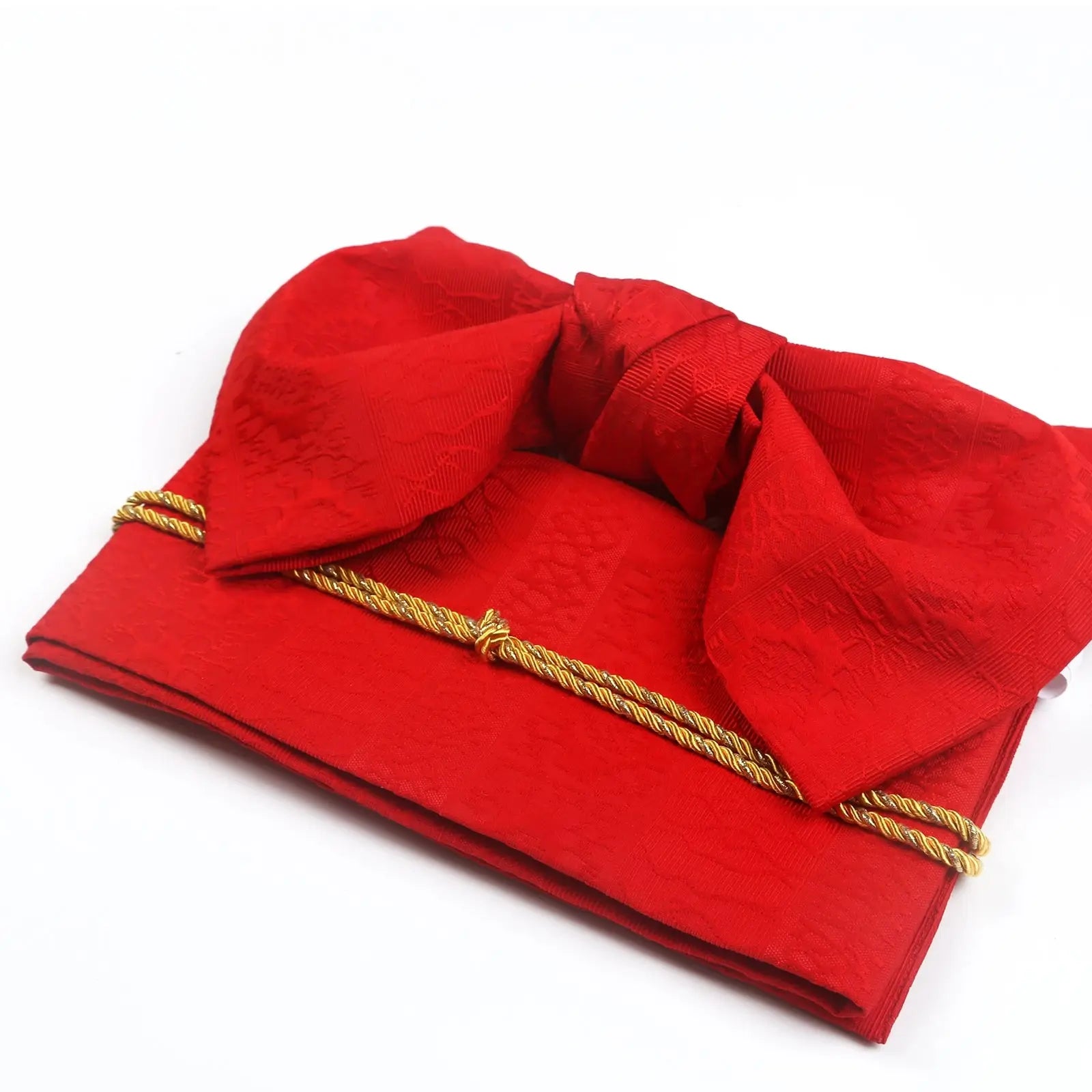 Red brocade bow belt with gold cord, folded for display, ideal for Japanese kimono waist seal and yukata styling for events.