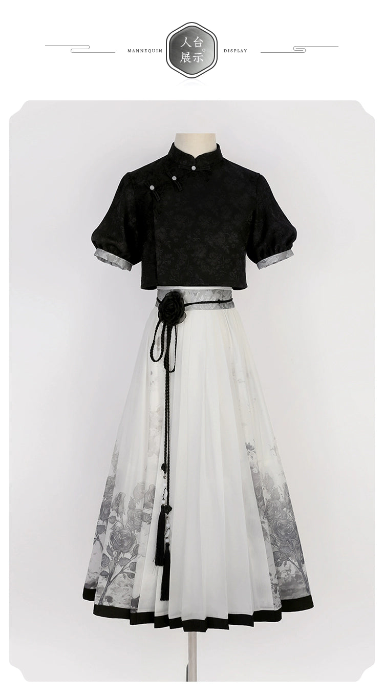 Mannequin display of Chinese black top and floral print skirt set, highlighting modern Hanfu design for spring and summer.