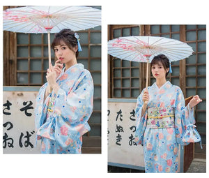 Two images featuring a woman in a light blue floral kimono yukata. A cute and graceful Japanese-inspired dress with a stylish obi.