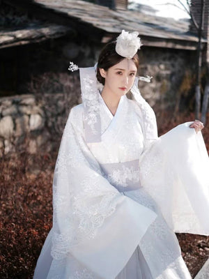 White Yanji Hanbok court dress with detailed embroidery and wide sleeves, traditional Korean national costume for daily elegance.