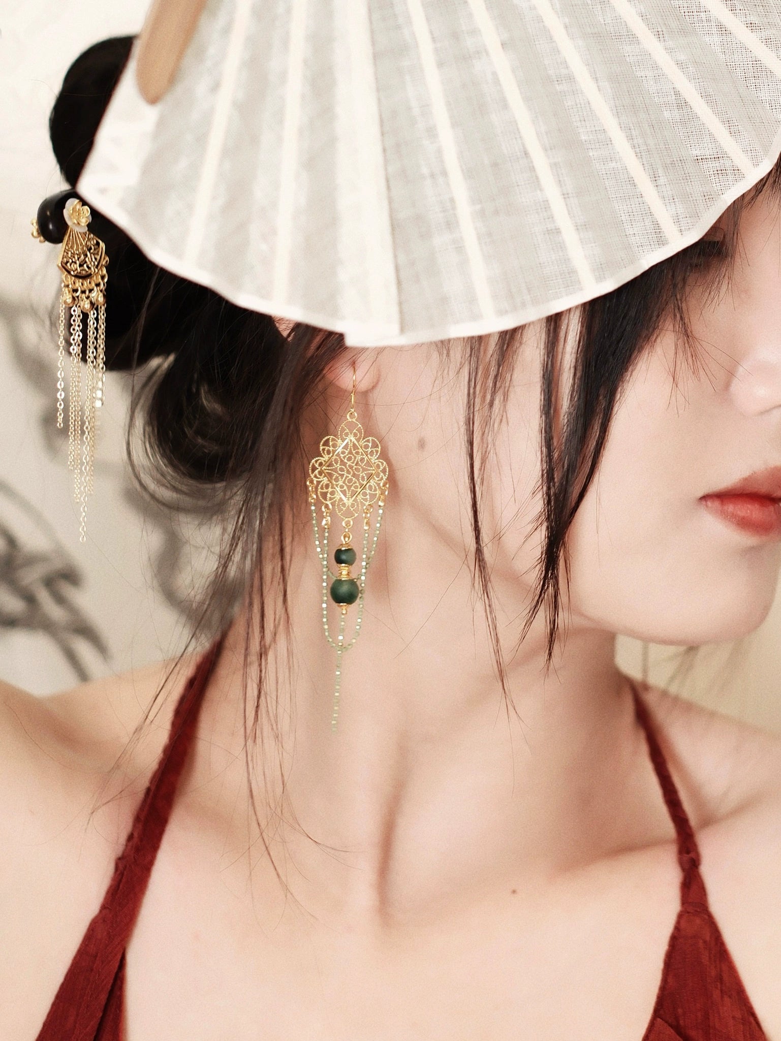 Su Mask Ear Clips - Hanfu Gold Tassel Earrings worn with traditional hairstyle and fan, showcasing elegant long design and green chalcedony.