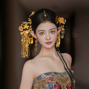 Elegant Chinese bridal headgear with butterfly tassel hairpin, showcasing intricate gold craftsmanship and floral embellishments.