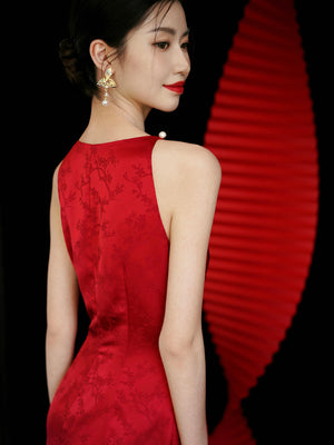 Close-up of red cheongsam dress back with floral embroidery, perfect for wedding or engagement events.