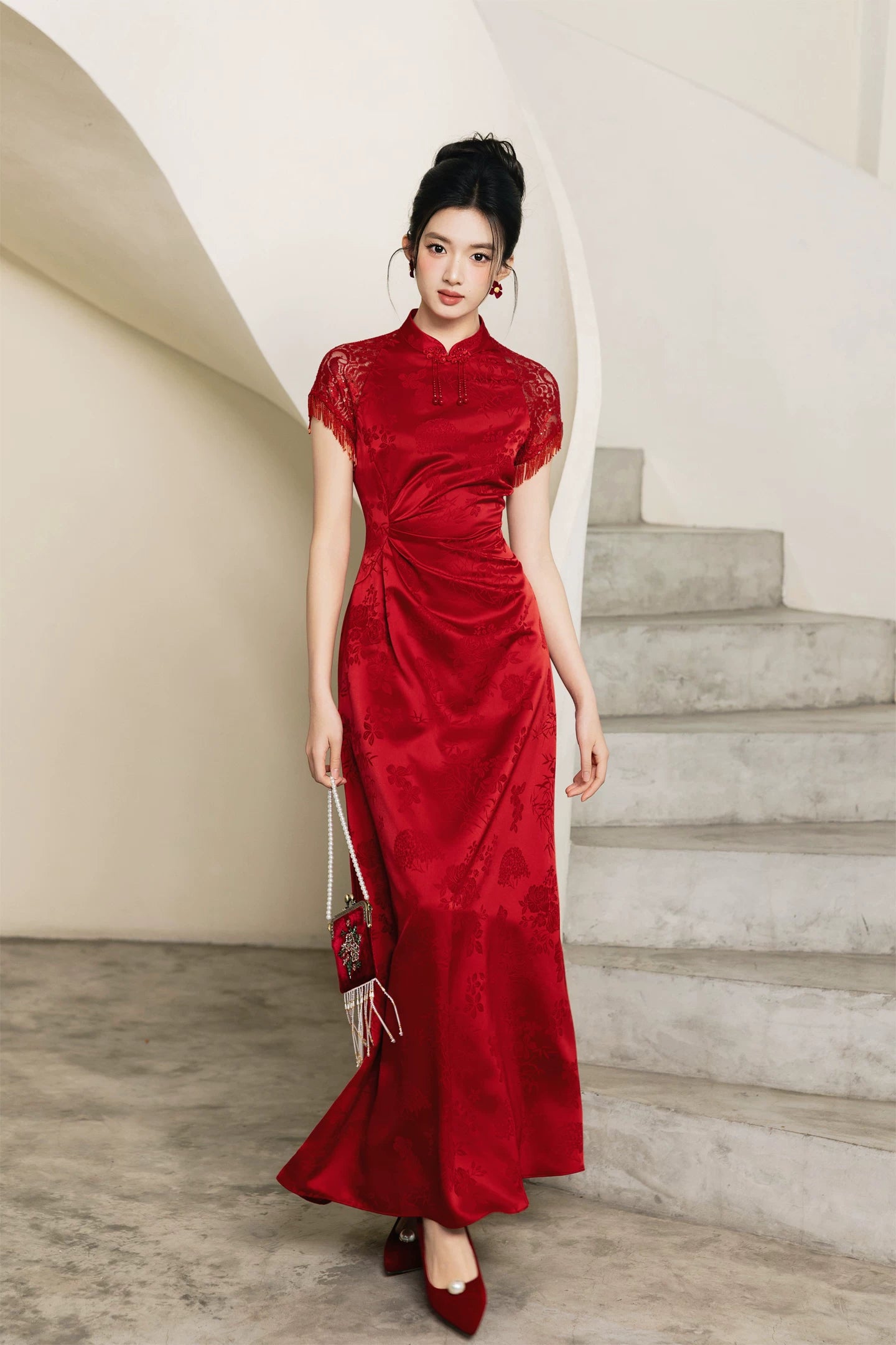 Red A-line bridal cheongsam, full-length front view with round fan