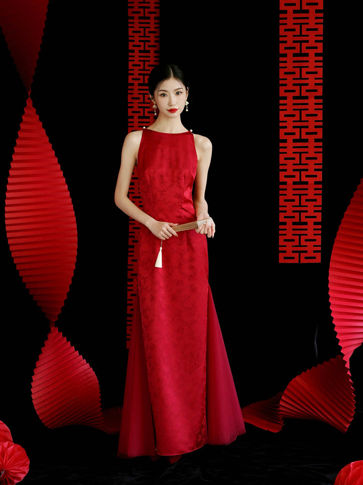 Red cheongsam wedding dress with intricate floral design, styled for traditional bridal engagement or toasting events.