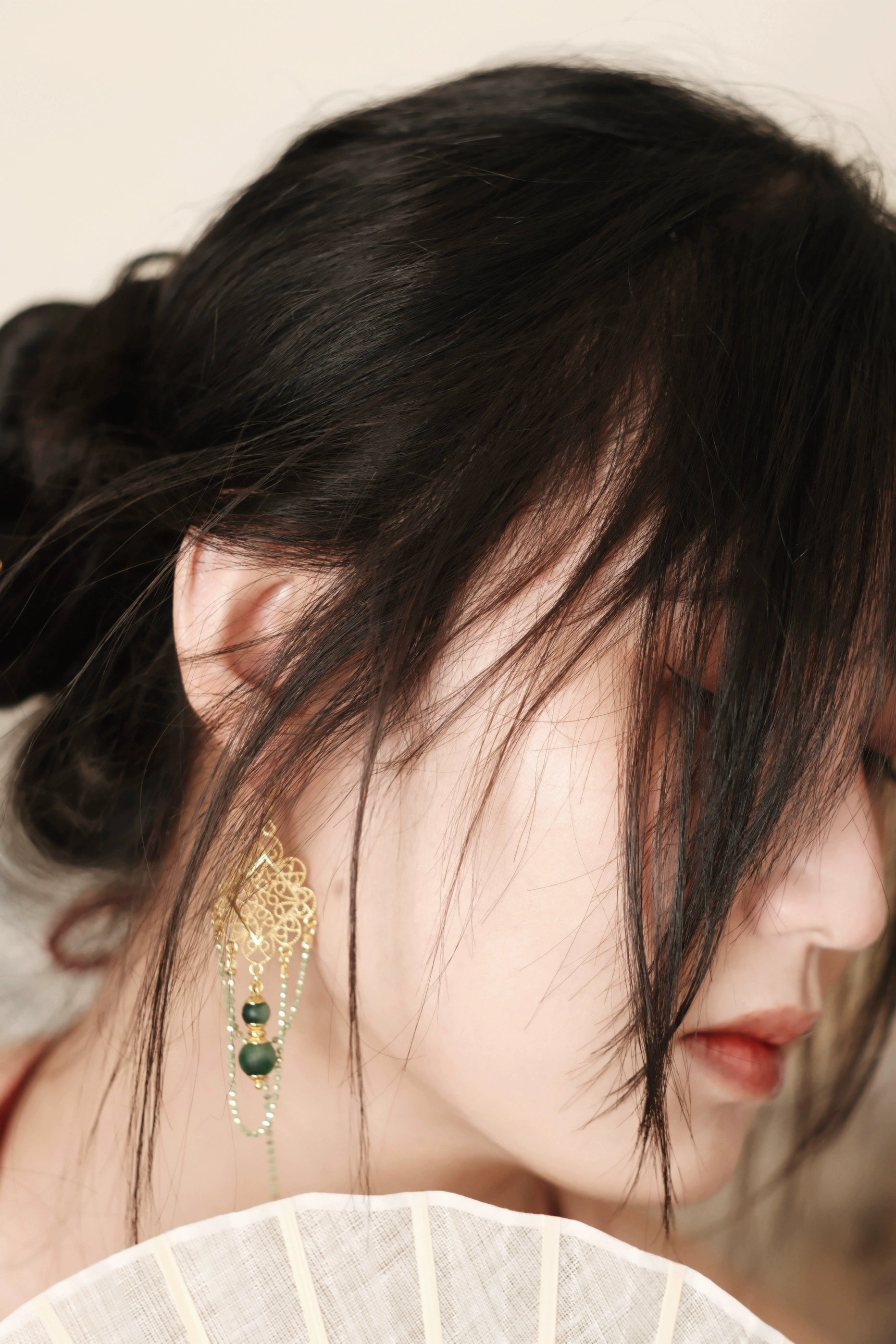 Su Mask Ear Clips - Hanfu Gold Tassel Earrings worn with traditional hairstyle, showcasing elegant green chalcedony and floral gold detailing.