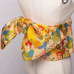 Yukata bow belt featuring a luxurious brocade design in gold with floral patterns. This kimono waist belt adds elegance with its stylish knot.