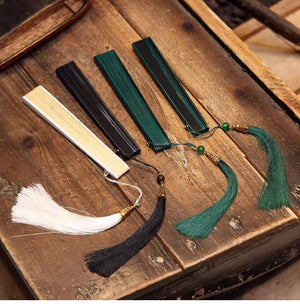 Assorted closed bamboo folding fans with tassels in white, black, and green. Ideal for Hanfu dance and traditional Chinese use.