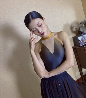 Forbidden Spring luxury Chinese-style halter top with gold choker and flowing dark skirt