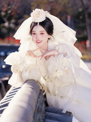 White Korean traditional wedding dress princess Hanbok with ruffled sleeves, woman posing outdoors