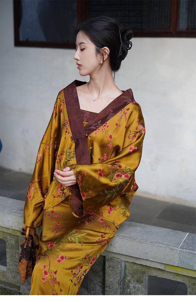 Golden Jelly Dress Set with fragrant cloud yarn jacket and floral jacquard pattern, styled in a serene courtyard with traditional architecture.